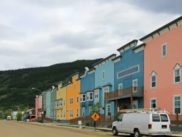 Multi-colored buildings on a street.